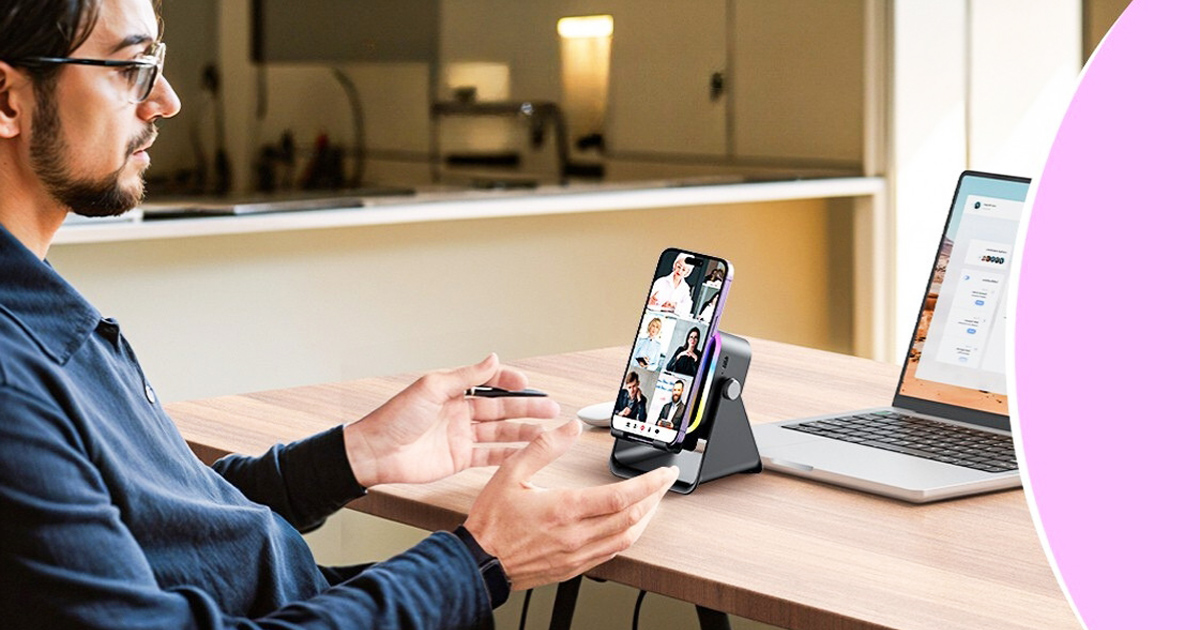 Man using a gadget at his desk