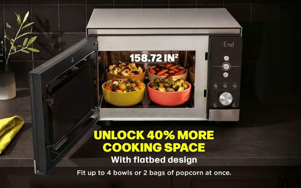 A large nine by eleven baking dish inside the turntable free flatbed microwave air fryer combo.