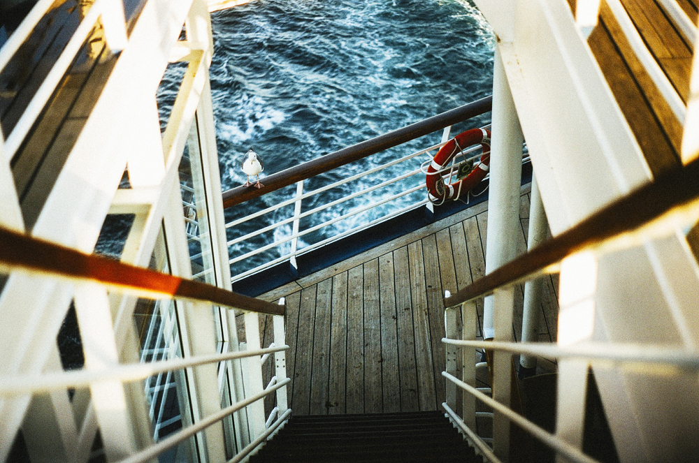 Guardrail on a cruise ship looking into the sea