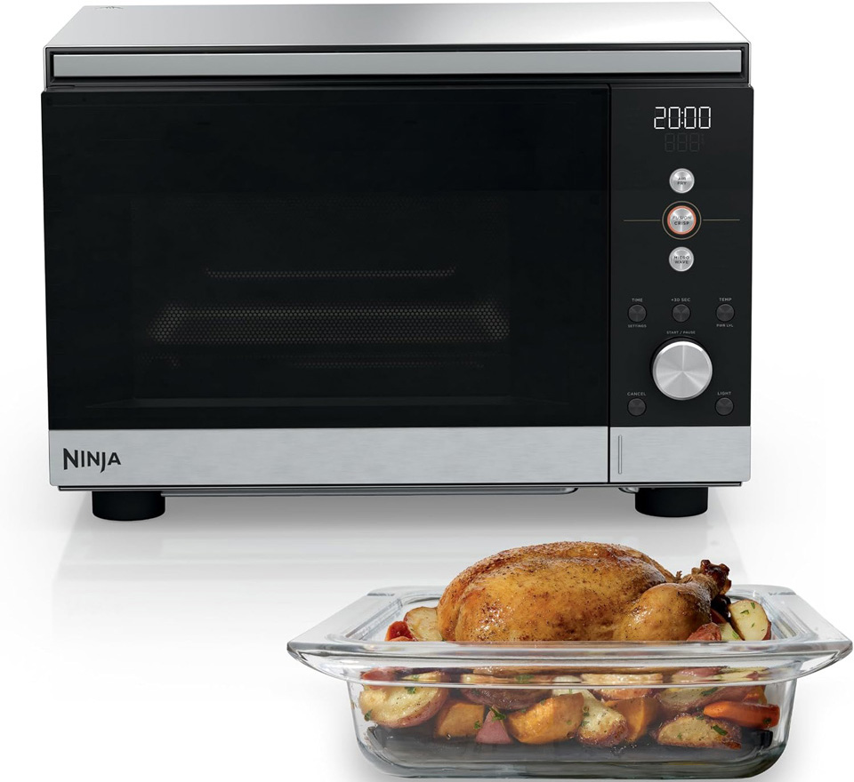 The countertop Ninja Crispi Microwave and Air Fryer with FusionCrisp display active in a modern kitchen.
