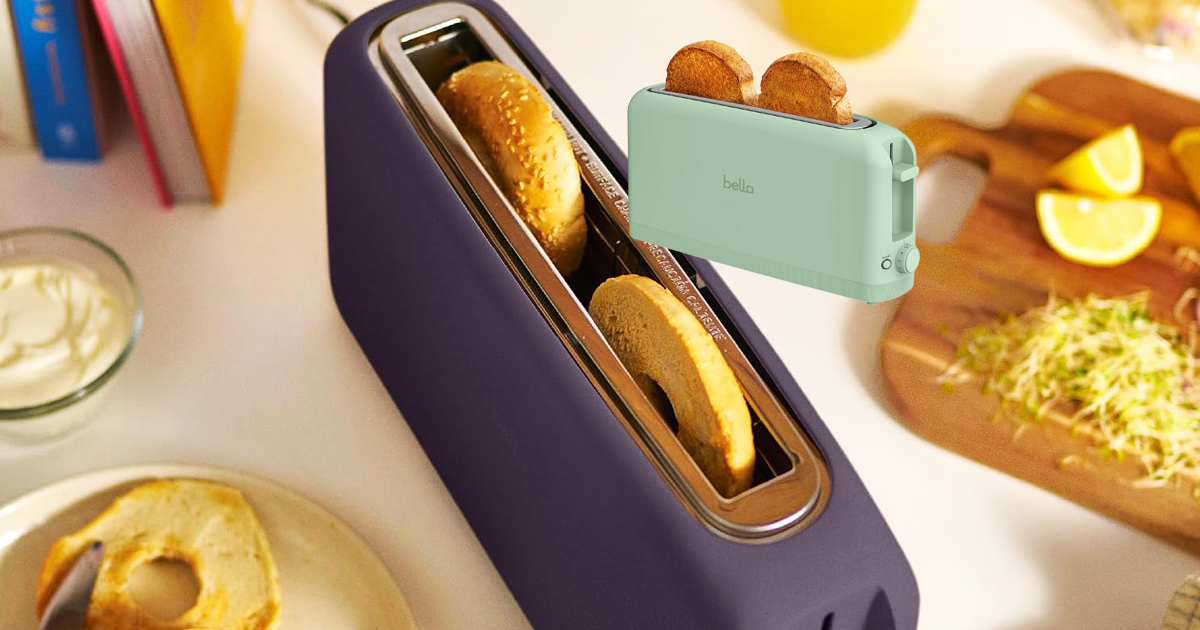 Mint green Bella Fits-Anywhere 2-Slice Slim Toaster with a long, narrow slot holding two slices of toast, set against a kitchen background with bread and breakfast food.