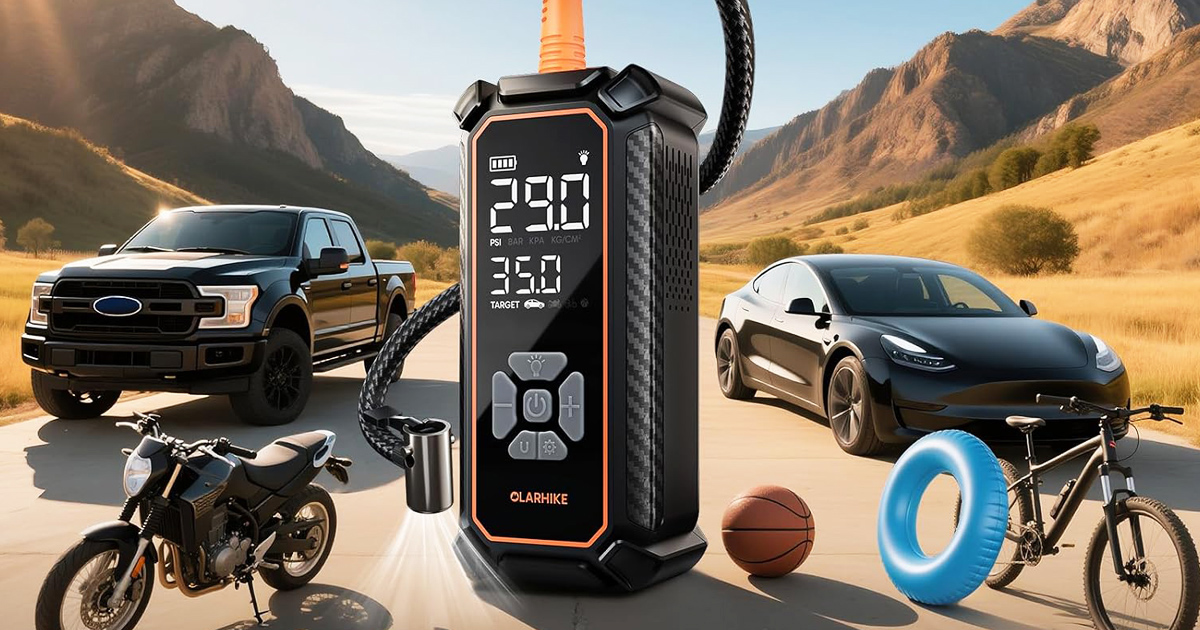 A close-up of the OlarHike portable tire inflator with an illuminated digital display, surrounded by a black pickup truck, a black car, a motorcycle, a bicycle, a blue pool ring, and a basketball on a mountainous road.