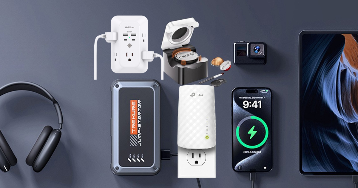 A flat lay collection of useful everyday tech gadgets and smart home upgrades on a dark background, including headphones, a multi-plug wall outlet, a portable car jump starter, a Wi-Fi extender, a smartphone, and an action camera.